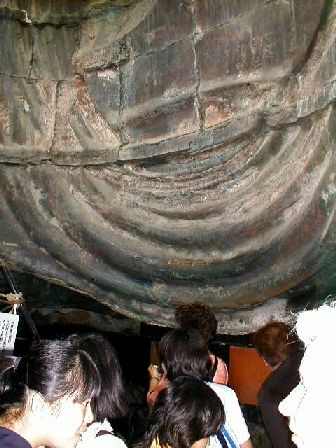 Inside the Buddha, with hordes of schoolkids