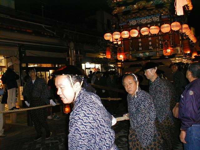 Men pull the floats through the streets of Takayama
