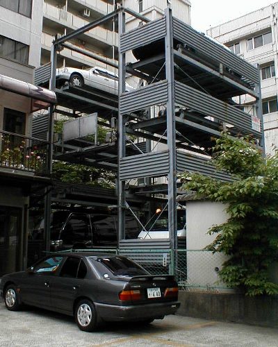 Fancy elevator technology in a Japanese garage.